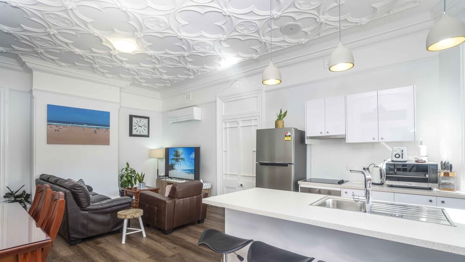 View of the kitchen, dining and living room open plan.