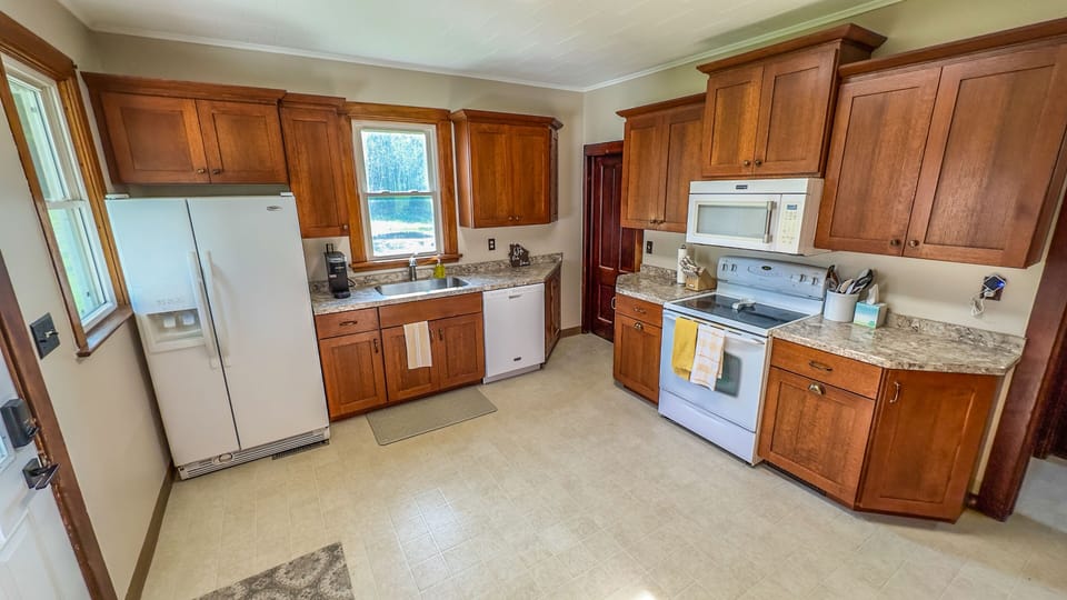 Kitchen; refrigerator, freezer, dishwasher, microwave, and oven