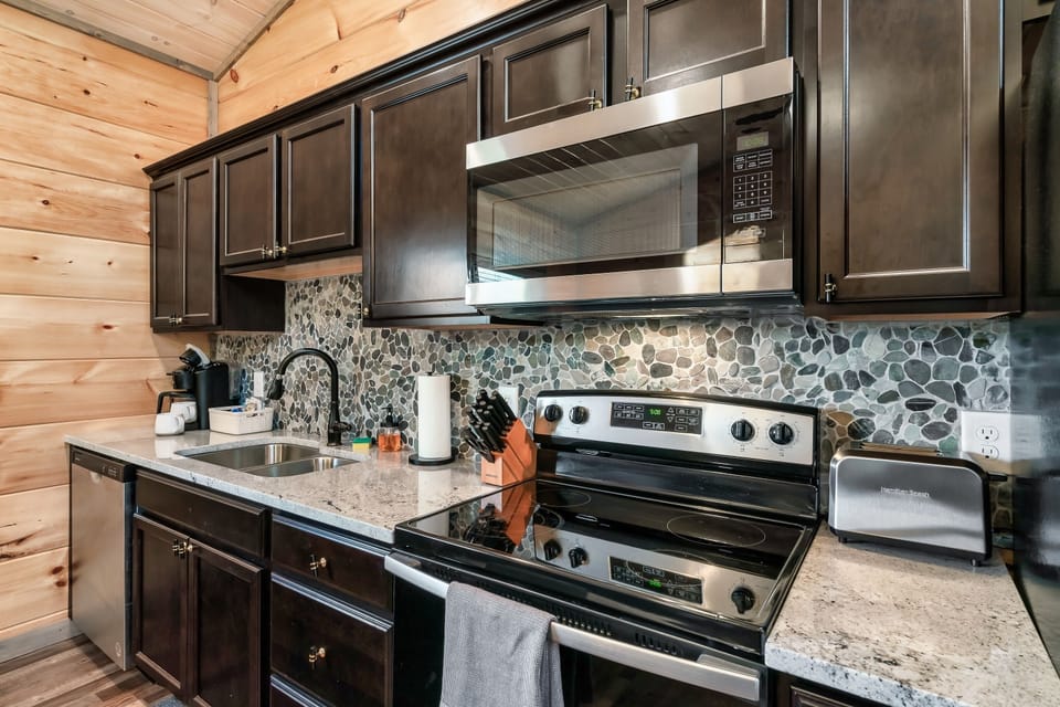 Kitchen contains most everything needed to prepare a family meal.