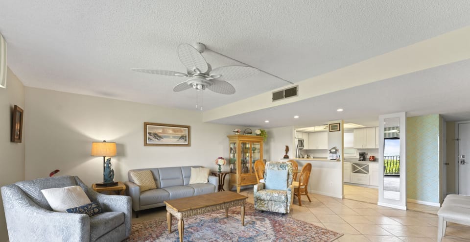 Spacious living area with soft lighting, perfect for unwinding.