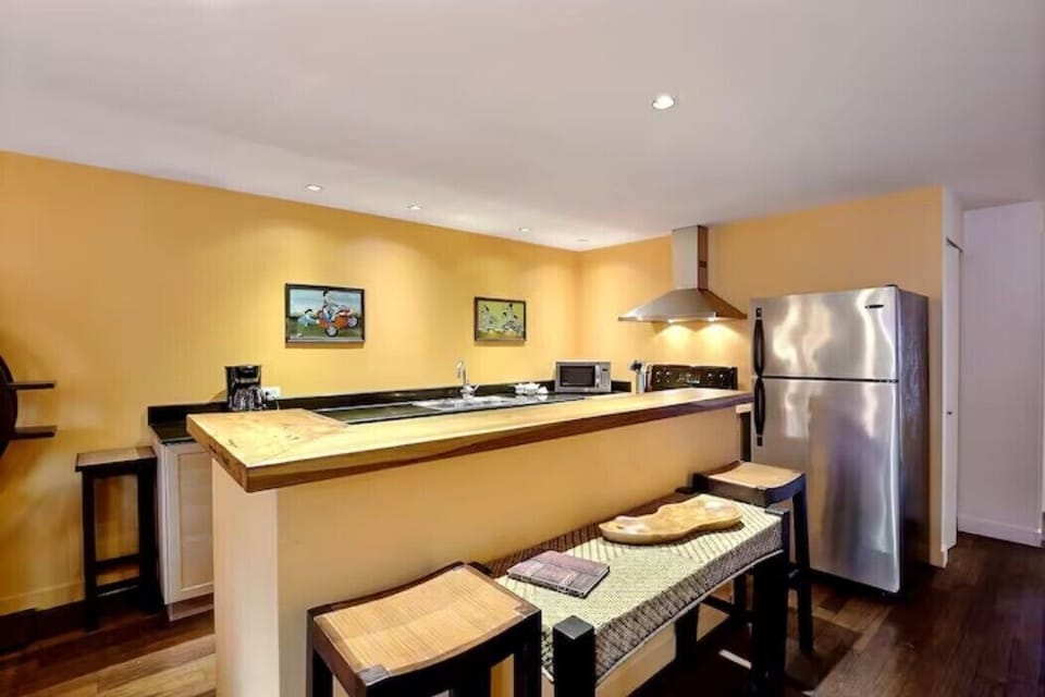 Teak bar with teak & bamboo stools overlooking our fully equipped kitchen