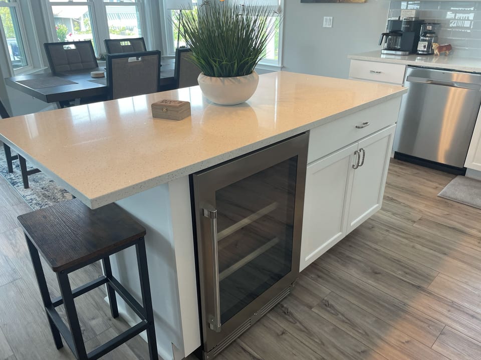 Kitchen island with beverage fridge.