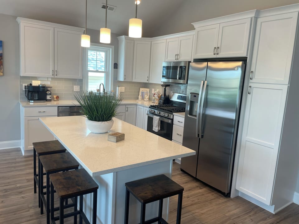 Kitchen with stainless steel appliances.