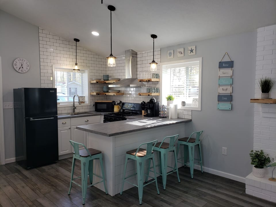 kitchen - free coffee bar, island with seating all cooking utensils 