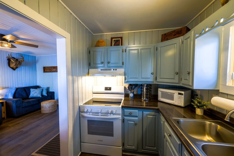 The kitchen flows straight into the living room so no one misses a moment of fun.