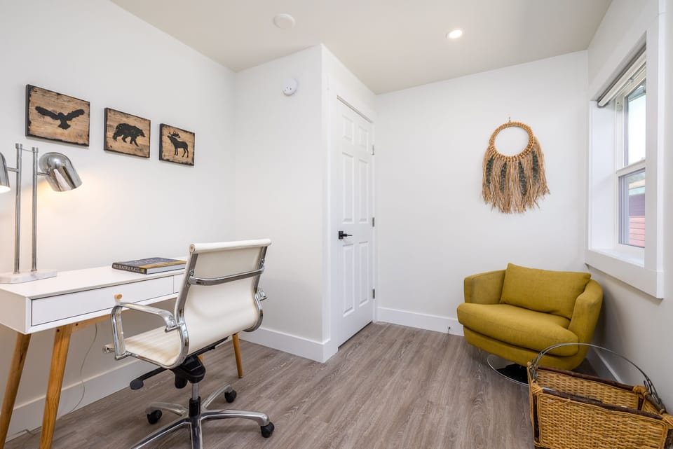 Enjoy a dedicated working station and reading area in a bright Den 