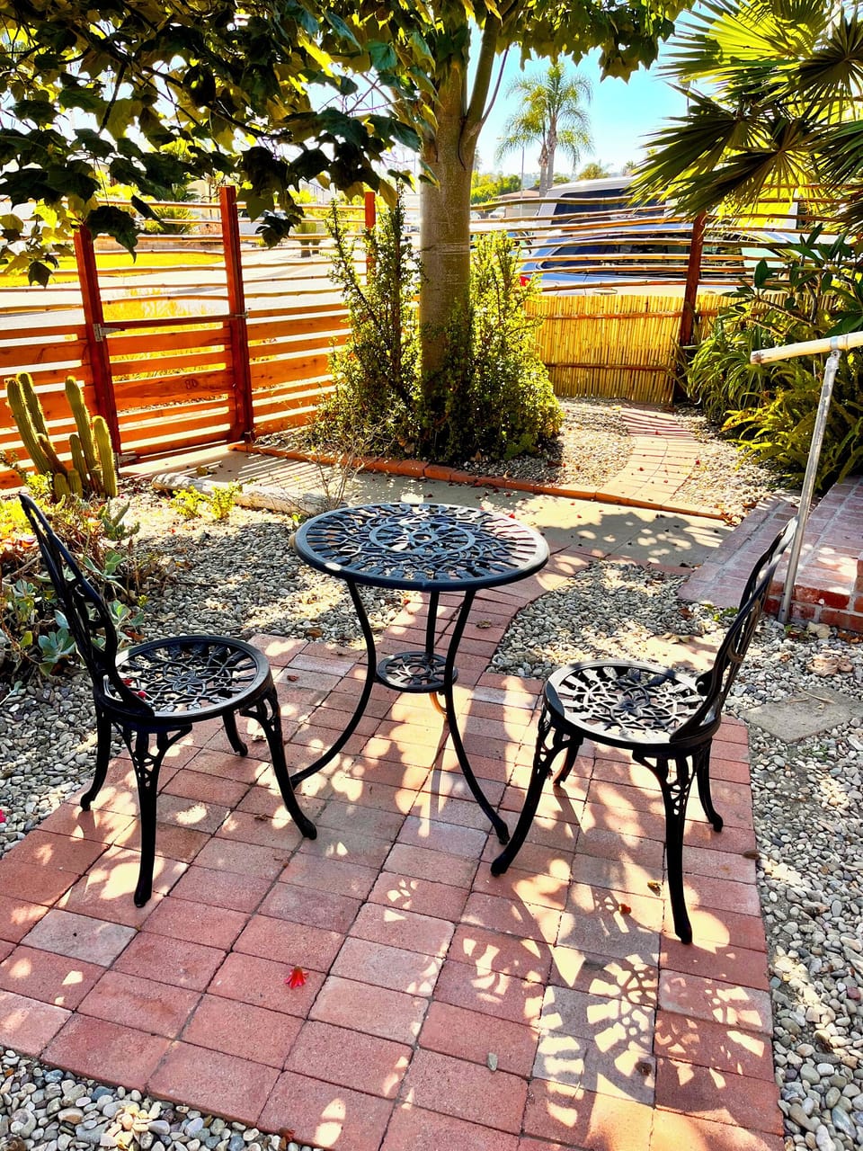 Private front yard with table for food and drinks under the sun!