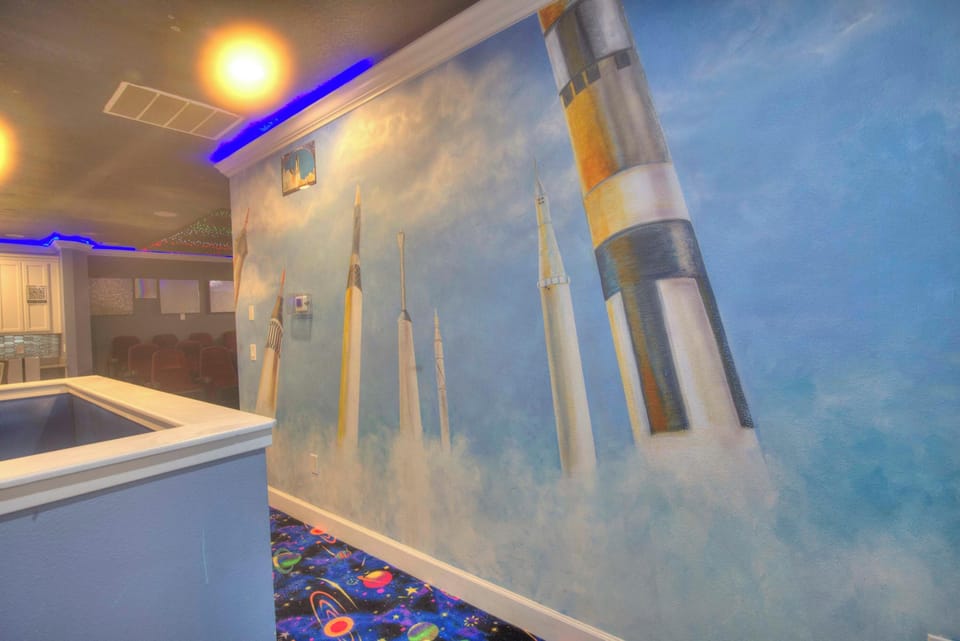 Explore the cosmos in this unique space-themed room with a private theater for an out-of-this-world experience.