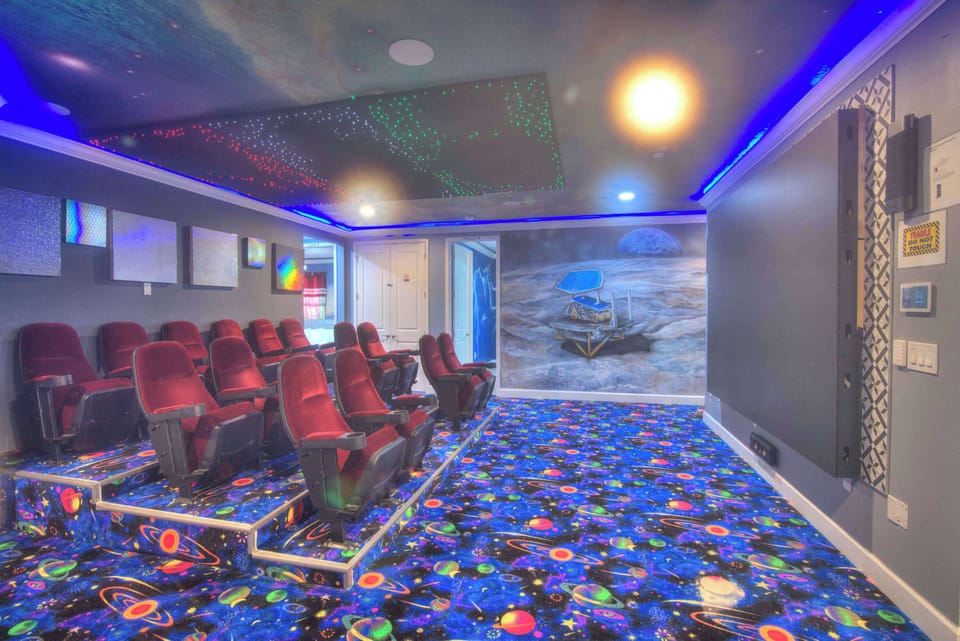 Experience cinematic magic in your private space-themed home theater, perfect for movie nights with family and friends.