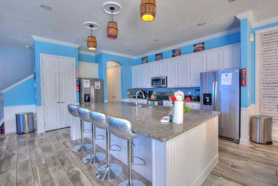 Modern kitchen with a large island and sleek appliances, perfect for entertaining and family gatherings.