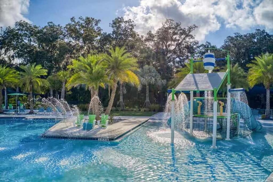 Enjoy a fun-filled day at the expansive pool with exciting water features and lush tropical surroundings.