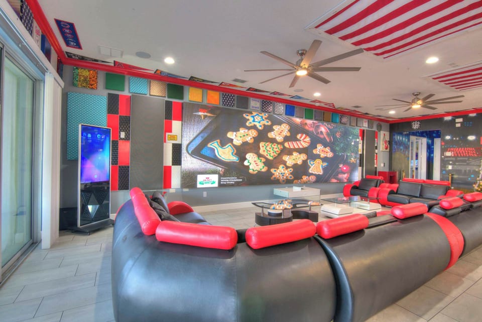 Experience entertainment like never before in this vibrant game room with plush seating and a massive screen for ultimate fun.