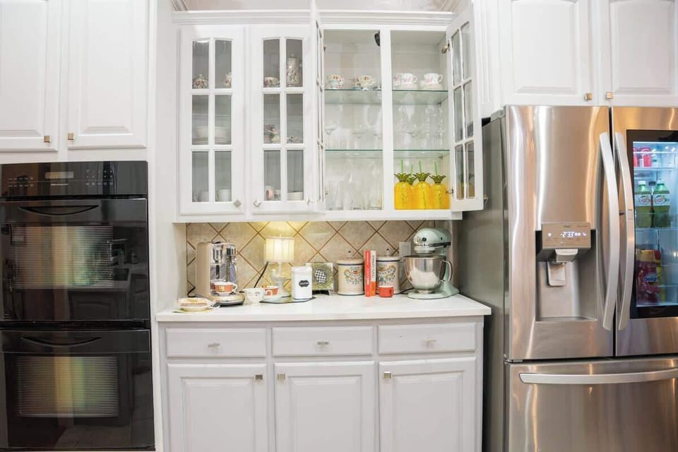 You will find all the glassware and outdoor drinkware you need in the lighted cabinets over the coffee bar.