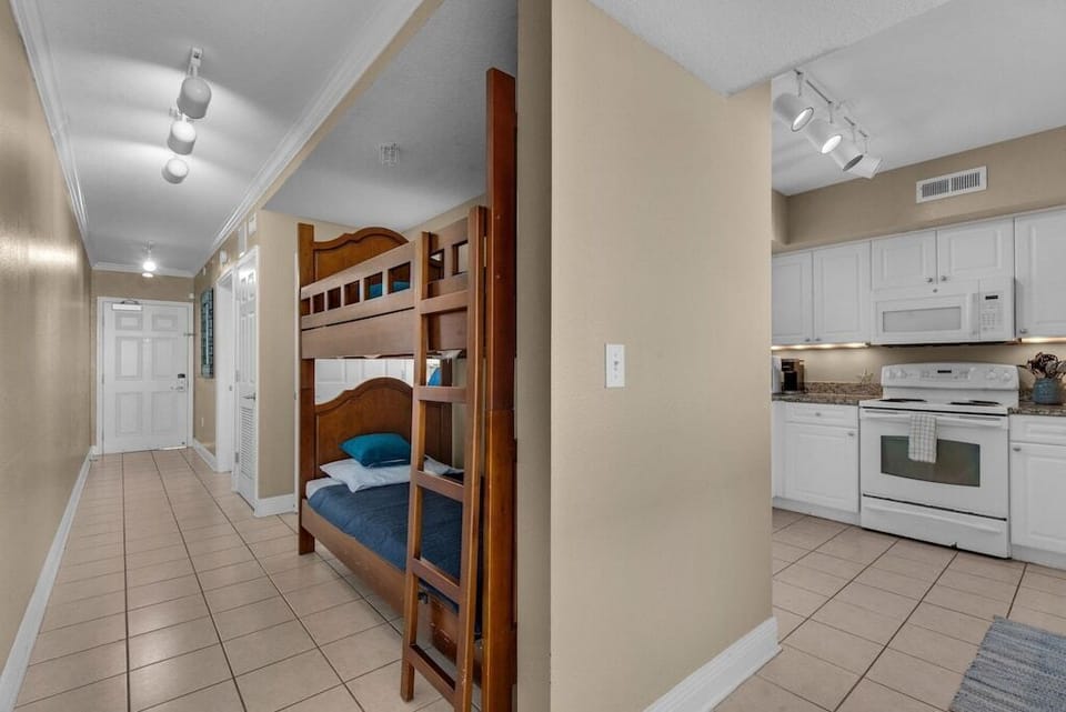 Hall with Twin Bunkbed and view to Kitchen