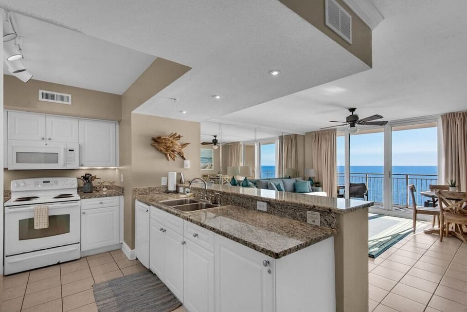 Kitchen with view of Living Room and balcony
