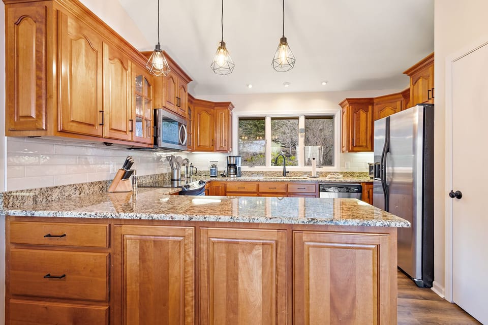 Large Fridge and Nice Kitchen Lighting