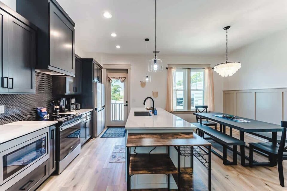 Gourmet kitchen stocked with everything you need so you can focus on making memories with the people you love:

Waffle iron, coffee maker, crockpot, blender, spices, wine glasses, pizza pan, serving dishware, dish pods, and more