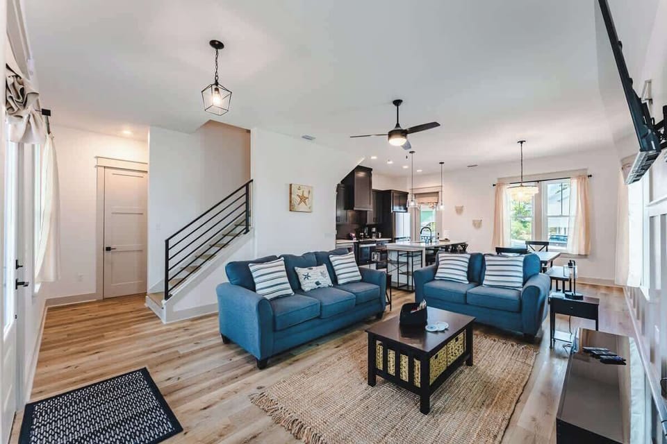 Everything is brand new! Soundbar, 60-inch roku smart tv, Blu-ray player. Dining area with seating for all of your guests. Gourmet kitchen.

Half bath right off the stairs on the main floor.
