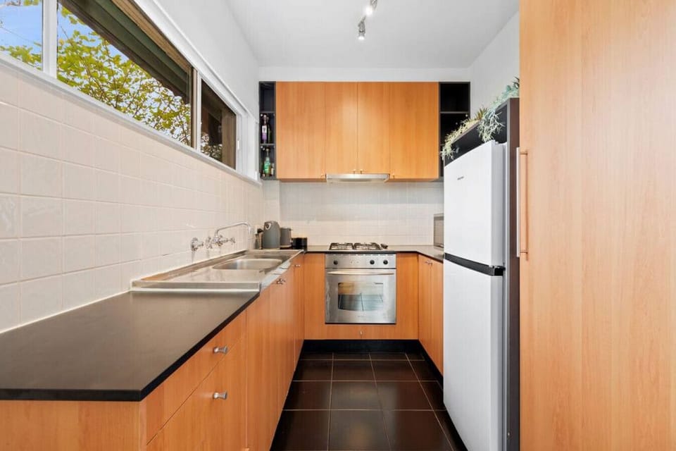 Kitchen with stainless steel cooking, microwave, toaster, kettle, pots, pans, crockery, cutlery and more...