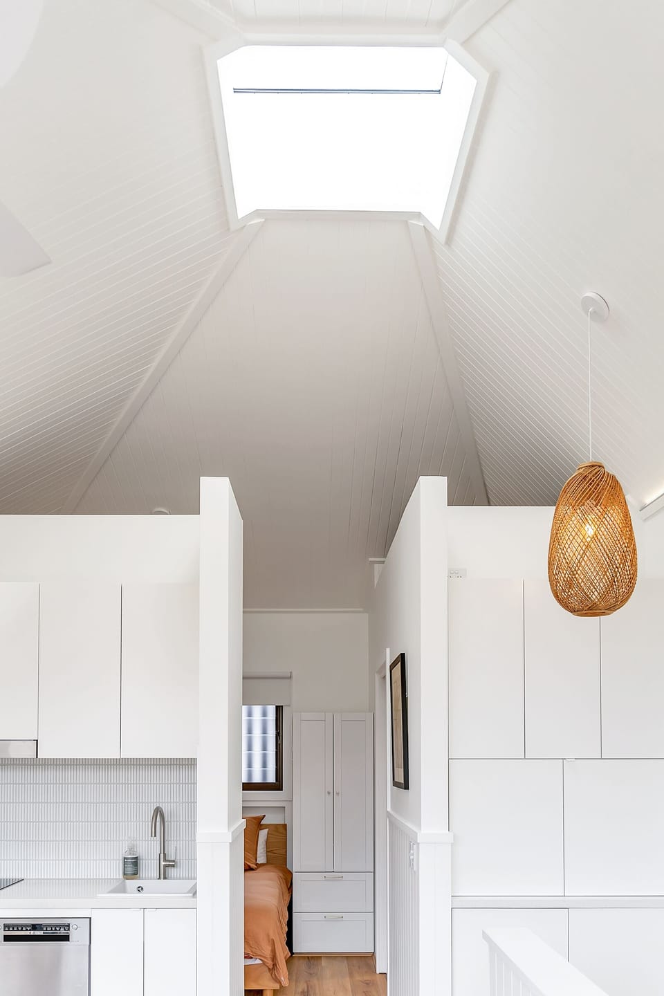 Skylight and cathedral ceilings make this gorgeous apartment feel so much larger