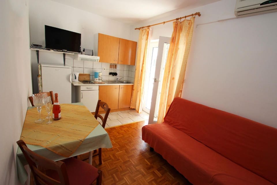 Living area. Dining area + Kitchen area