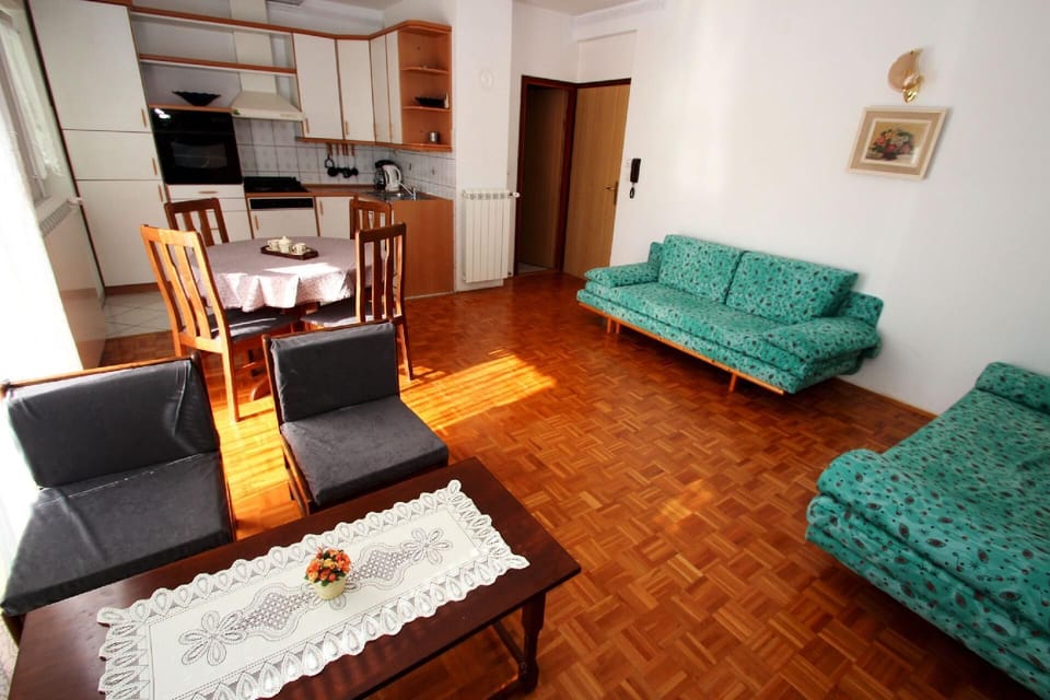 Living area. Dining area + Kitchen