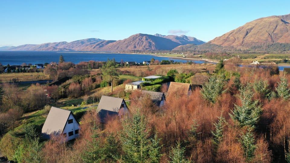 Inchree Cabins, with Loch Linnhe & hills of Ardgour beyond