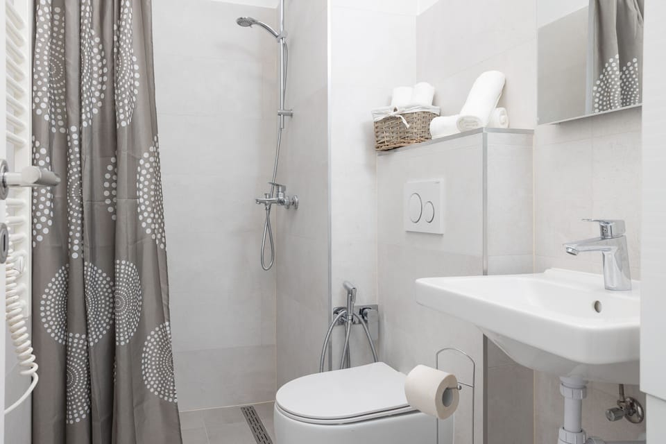Bathroom with shower, toilet and sink