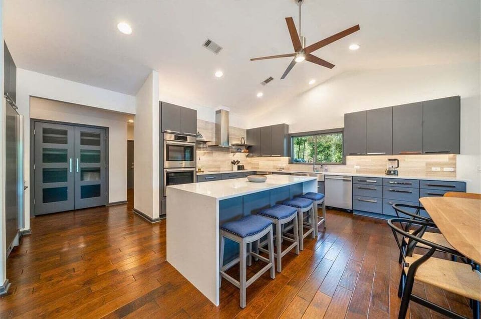 Living Room Connects to the Spacious Eat in Kitchen with Island