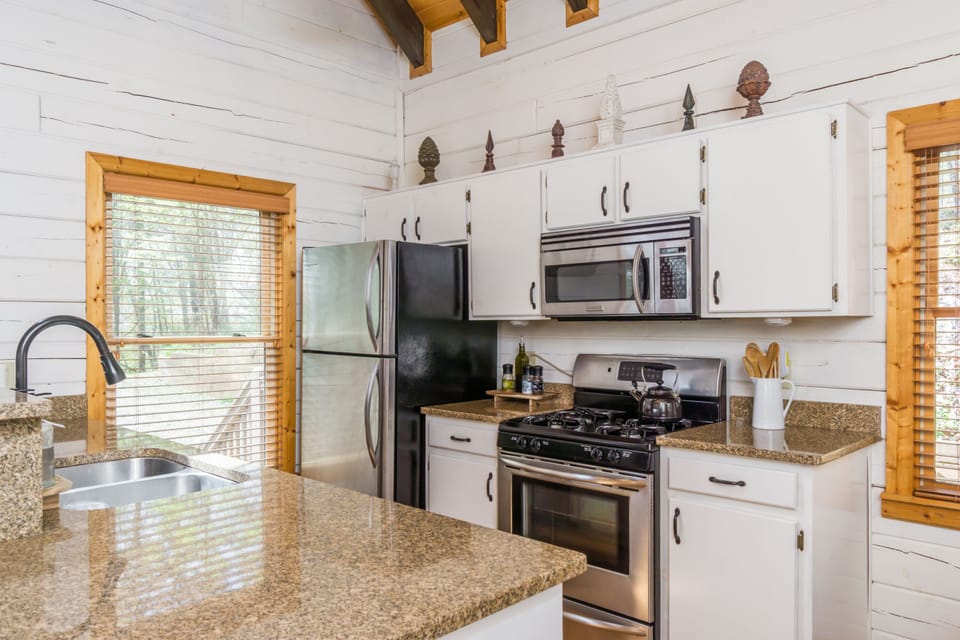 Kitchen with dishwasher, stove and microwave