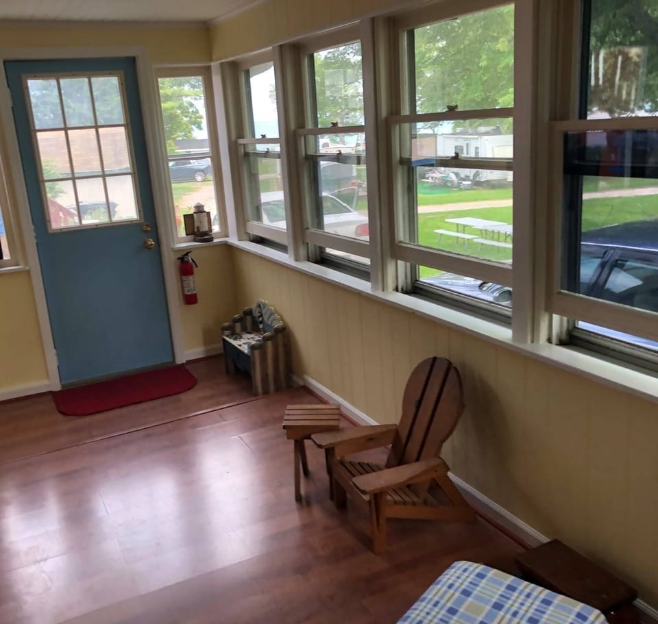 Your private entrance with small step up and down in sun porch area with desk.
