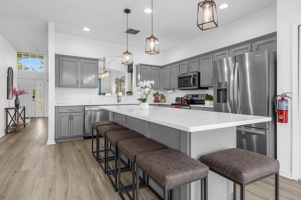 Kitchen is equipped with essentials and a large pantry
