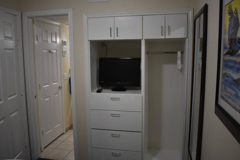 Closet, drawers, TV and access to the jack - n - jill bath from the bedroom