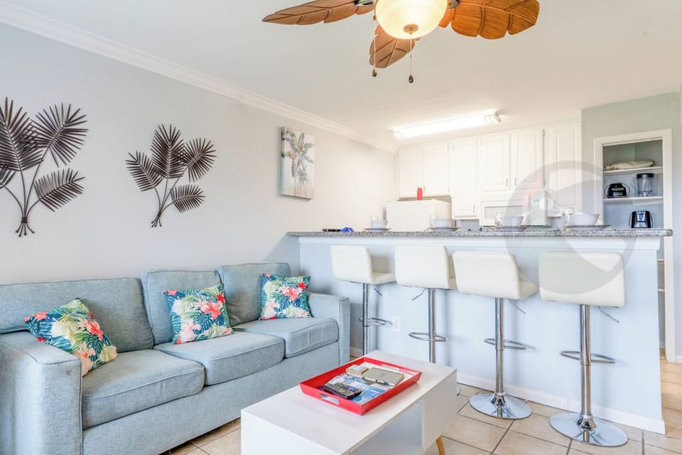 Step in from the balcony to living and kitchen areas