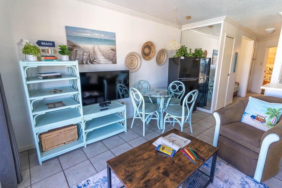 A second flat screen TV and a place to dine or play family games