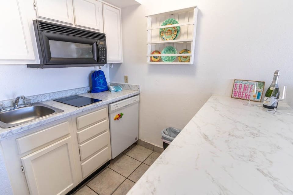 Kitchen has 2 burner cooktop, microwave, dishwasher and all you need for breakfast, lunch & dinner