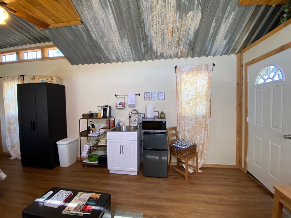 Kitchenette equipped with fridge, microwave, Keurig and dishes, mugs & utensils