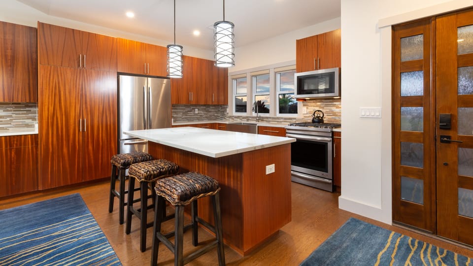 Gourmet kitchen with additional island seating for 3