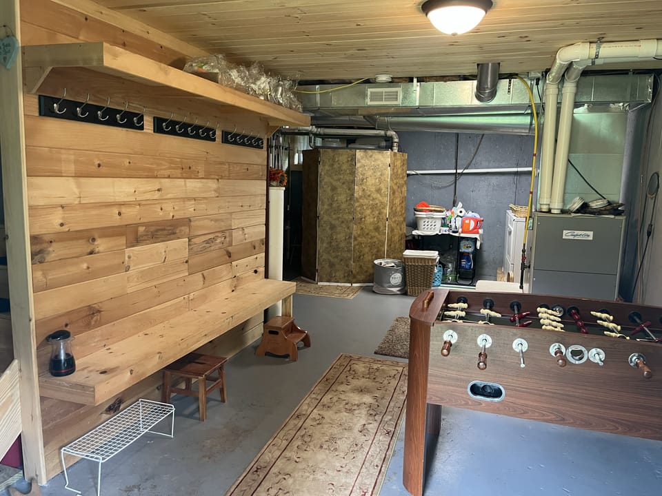 Walk-out basement separate entrance to hang coats, helmets