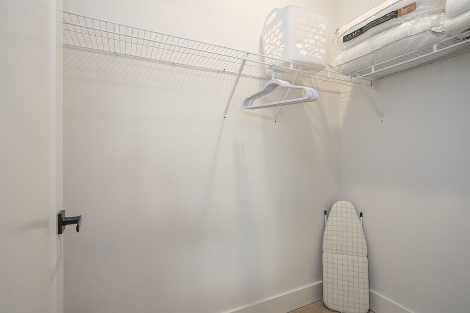 Our spacious walk-in closet is fully stocked with extra bedding and blankets.