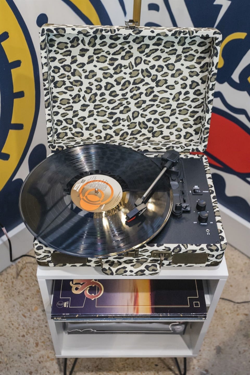 Experience the King's greatest hits with our vintage record player!