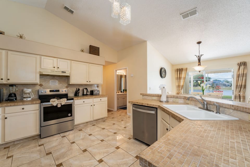 Spacious kitchen that is well-stocked for in home meals.