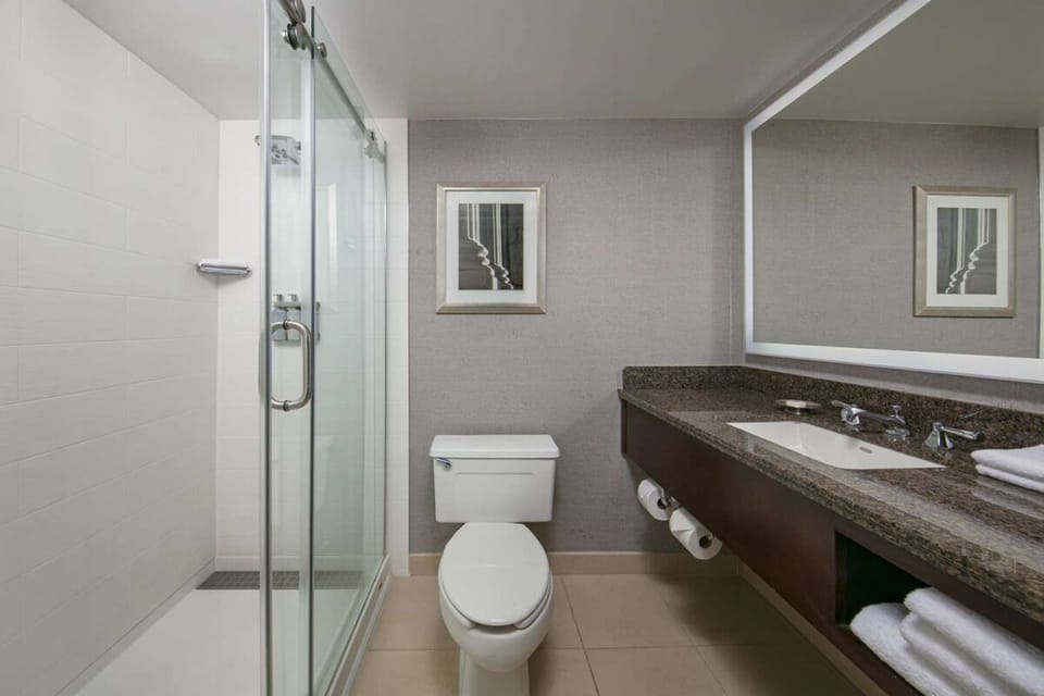 Refresh in a spotless bath with sleek glass shower.