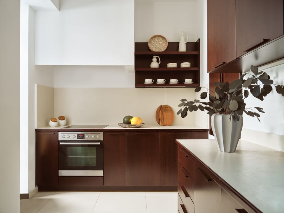 An open-plan fully equipped kitchen, awaits you for culinary wonders. 