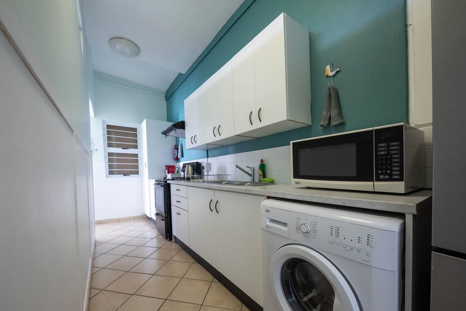 The kitchen equipped with a washing machine