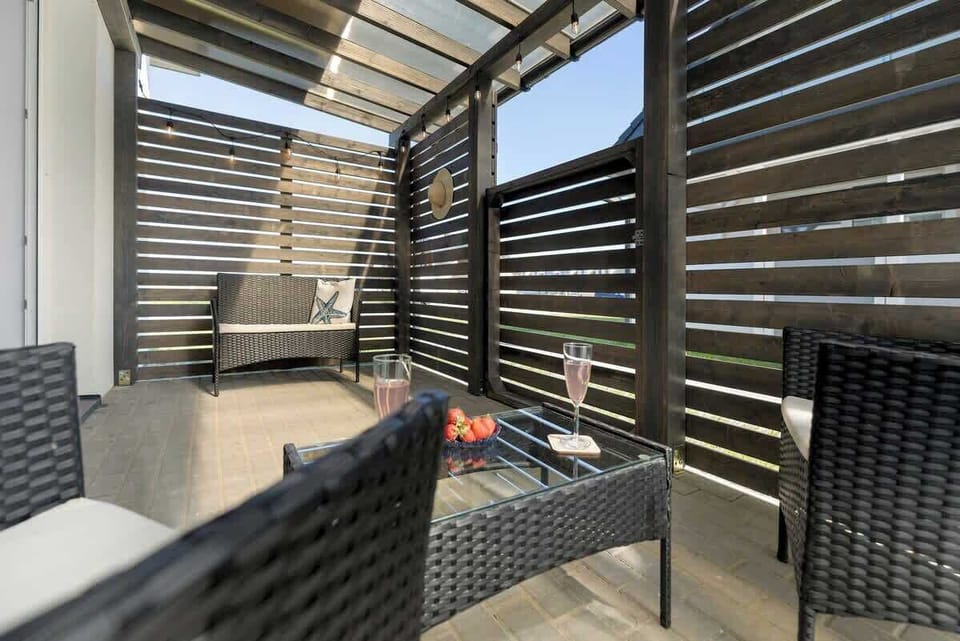 A wide view of the outdoor seating area, showing its seamless blend of style and functionality.
