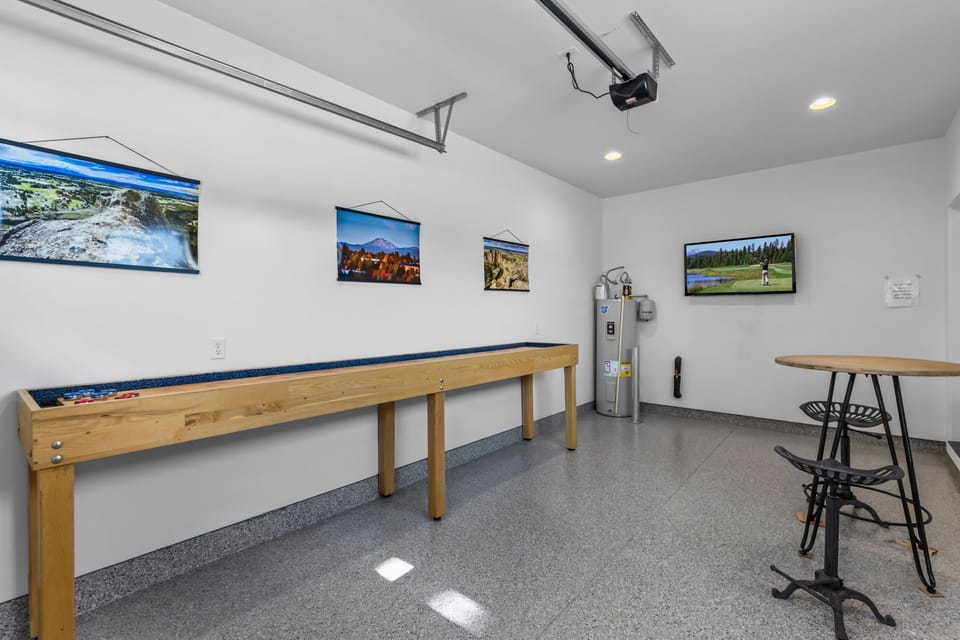 Garage w/ shuffleboard table and TV