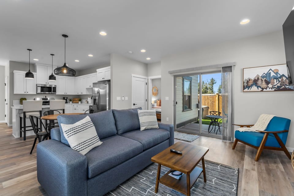 Living area w/ fireplace and sleeper sofa