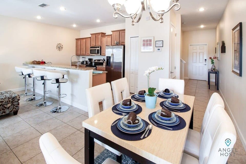 Comfortable dining table for 6 and bar countertop with 4 bar stools.