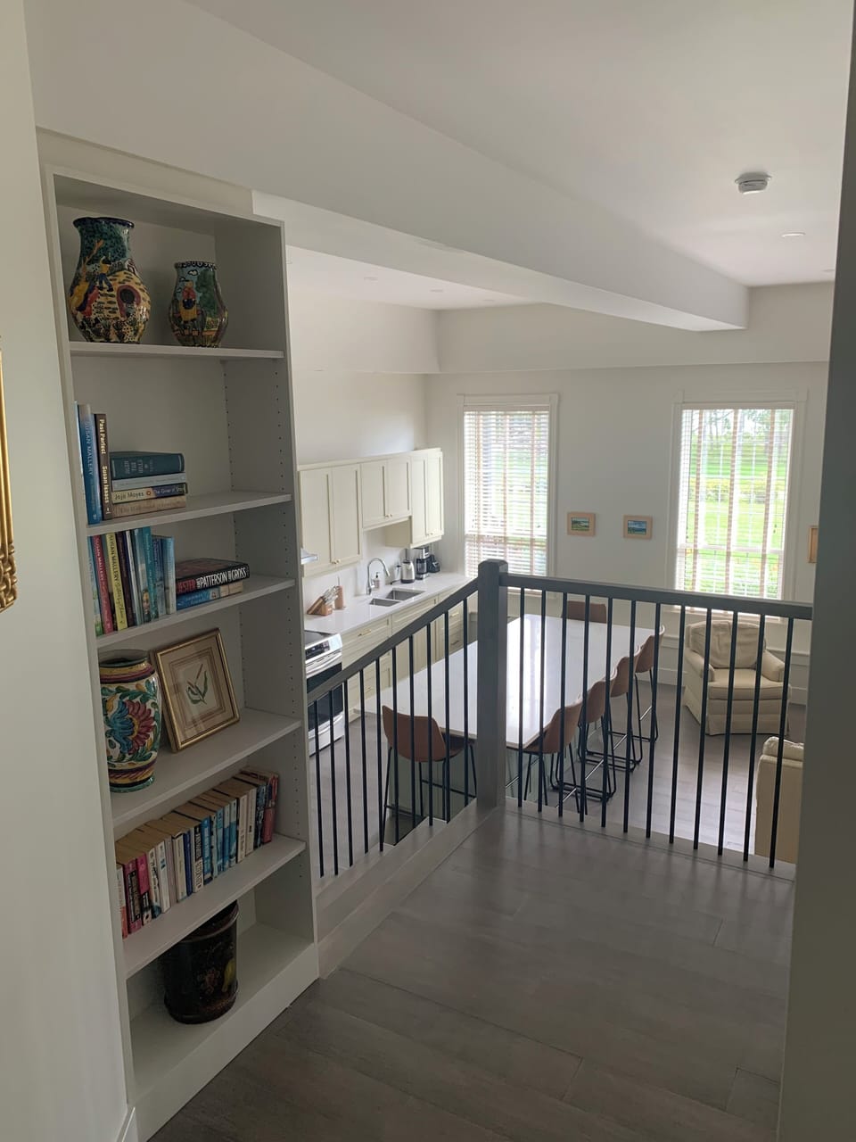 Hallway, bookcase and stairs from the bedrooms down